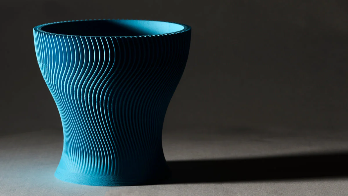Matte PLA Light Blue textured vase on a dark background